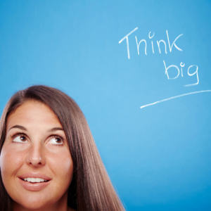 Woman looking at statement Think Big